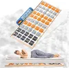 A woman sleeping on a mattress, with a bed frame and a slatted base shown above, set against a cloudy background. Produktbild-Vorschau
