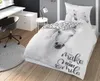 A bedroom scene with a bed, desk, and chair, showcasing bedding with a horse print. Voir les images du produit