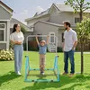 A family is in their backyard with a child on a pull-up bar. Náhled obrázku produktu