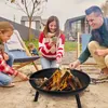 A family is gathered around a fire pit, roasting marshmallows. Produktbild-Vorschau