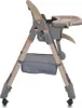 A side view of a beige and gray baby high chair against a white background. Produktbild-Vorschau