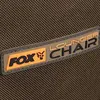 A close-up of a patch on a brown fabric background, showing the brand name 'FOX' and 'LOUNGER CHAIR'. Produktbild-Vorschau