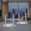 Two table legs are shown in a modern living room setting with a large window overlooking a city at dusk. Podgląd zdjęcia produktu