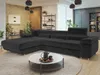 A modern living room with a large black sectional sofa, a white coffee table with teacups and a teapot, and decorative elements like plants and shelving.