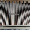 A close-up view of a metal grill grate with a logo and text. Anteprima dell’immagine prodotto