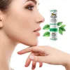 A close-up profile of a woman's face next to a Tiger Balm inhaler and mint leaves. Náhled obrázku produktu