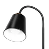 A close-up shot of a black floor lamp with a flexible gooseneck and a gold accent. Náhľad obrázku produktu