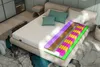A cutaway view of a mattress showing its internal layers, placed on a bed in a bedroom setting. Produktbild-Vorschau