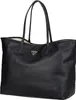 A black Guess shopper bag with a gold logo is shown against a white background. Produktbild-Vorschau