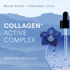 A close-up of a serum dropper with a blue flower and bubbles against a backdrop of blue mountains. Anteprima dell’immagine prodotto
