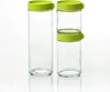 Two glass canisters with green lids are shown against a white background. One canister is stacked with a smaller canister on top, both with green lids. Produktbild-Vorschau