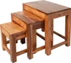 A set of three wooden nesting tables of varying sizes. Produktbild-Vorschau