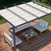 An outdoor patio scene with a pergola, seating, and a coffee table. Produktbild-Vorschau