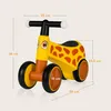 A yellow and orange giraffe-themed balance bike with dimensions indicated by measurement lines and text. Anteprima dell’immagine prodotto
