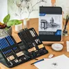 An open drawing set with pencils and accessories laid out on a wooden table, with a decorative background. Podgląd zdjęcia produktu