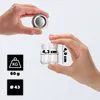 Hands holding a small glass jar and its lid, with dimensions and weight indicated. Produktbild-Vorschau
