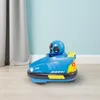 A blue bumper car toy sits on a light-colored floor in front of a light blue wall and a gray curtain. Produktbild-Vorschau