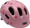 A pink children's helmet with fairy and butterfly decorations. Produktbild-Vorschau