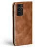 A close-up side view of a brown leather flip case for a smartphone. Produktbild-Vorschau