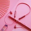 A pair of rose pink in-ear headphones is laid out on a pink background with a decorative fan. Produktbild-Vorschau