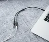 A close-up shot of a Ugreen audio cable connecting to a laptop. Anteprima dell’immagine prodotto