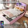 A pink upholstered bed with storage, featuring RGB LED lighting and a shelf headboard, in a bedroom setting. Náhled obrázku produktu