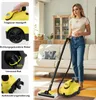 A woman is using a yellow steam cleaner in a living room. Produktbild-Vorschau