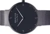 A close-up, top-down view of a black Bering Max René watch with a mesh band. Náhľad obrázku produktu