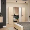 A bedroom scene featuring a wardrobe and a bed. Produktbild-Vorschau