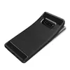 A black phone case with a brushed metal texture and carbon fiber accents is shown against a white background. Produktbild-Vorschau
