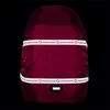 A burgundy backpack cover with reflective stripes and branding. Podgląd zdjęcia produktu