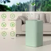 An air purifier is shown in a living room setting next to a couch, with icons indicating its functions. The background is a blurred outdoor scene of trees. Produktbild-Vorschau