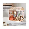 A miniature dollhouse room with furniture and accessories. Anteprima dell’immagine prodotto