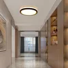 A modern hallway with a ceiling light and built-in shelving unit. Produktbild-Vorschau