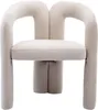 A beige velvet armchair with a unique curved design. Voir les images du produit