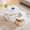 Two round coffee tables with marble-like tops and gold metal frames are placed on a rug in a living room setting. Náhľad obrázku produktu