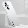 A white smartphone case with a silver metallic finish is displayed at an angle, leaning against two white blocks. Produktbild-Vorschau