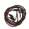 A coiled audio cable with a 3.5mm jack and two connector ends. Náhled obrázku produktu