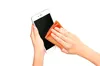 A person is cleaning a smartphone screen with a microfiber cloth. Anteprima dell’immagine prodotto