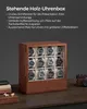 A wooden watch box filled with 12 watches is displayed on a wooden surface, with a camera and books in the background. Produktbild-Vorschau
