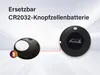 Two black circular devices are shown against a light gray and white background. The device on the left is open, revealing a white battery. A battery icon is shown to the left of this device. The device on the right has a logo in the center. A red line conn Náhled obrázku produktu