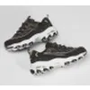 A pair of black and white Skechers sneakers are shown on a white background. Voir les images du produit