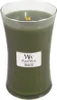 A green WoodWick candle in a clear glass jar with a wooden wick. Náhled obrázku produktu