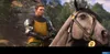 A man in medieval armor rides a horse in a forest setting. Produktbild-Vorschau