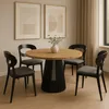 A round dining table with chairs in a well-lit room with artwork on the wall and curtains in the background. Podgląd zdjęcia produktu