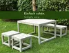 A garden furniture set with a table and benches on a grassy lawn. Anteprima dell’immagine prodotto