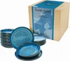 A set of blue ceramic plates and bowls are displayed next to a cardboard box with product information. Produktbild-Vorschau