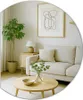 A bright and airy living room setting with a sofa, coffee table, and plant. Produktbild-Vorschau