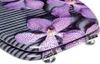A close-up view of a toilet seat with a floral and stone pattern. Náhľad obrázku produktu