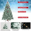 A decorated artificial Christmas tree with snow-like flocking and various features highlighted with text overlays. Produktbild-Vorschau
